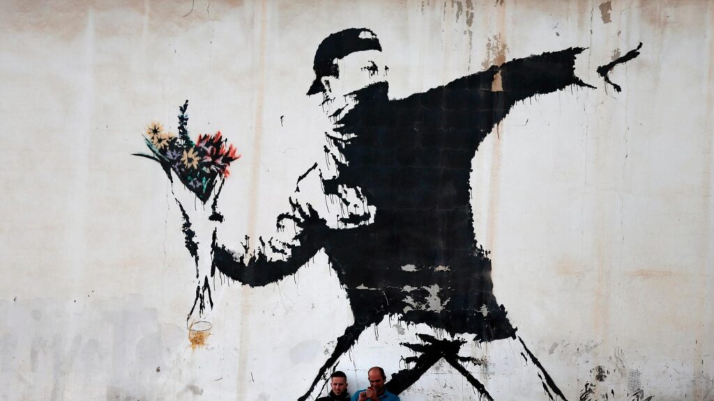 Banksy uomo con mazzo di fiori