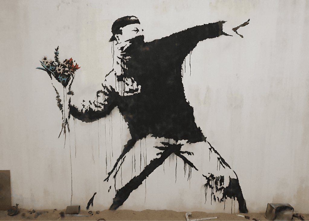 Banksy the flower thrower, flower bomber, rage, love is in the air Palestina 2003